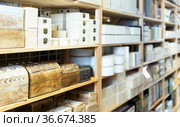 Supermarket of household goods - wooden original caskets on shelves. Стоковое фото, фотограф Яков Филимонов / Фотобанк Лори