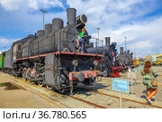 Russia, Verkhnyaya Pyshma, July 2021: Steam locomotives of the Ov and Eu series at the site of the Military Glory Museum of the Urals. Редакционное фото, фотограф Акиньшин Владимир / Фотобанк Лори