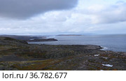 Landscape with Barents Sea and dramatic sky in autumn on the Kola Peninsula in northern Russia. Стоковое видео, видеограф Алексей Кузнецов / Фотобанк Лори