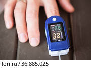 Screen of an oximeter while monitoring peripheral oxygen saturation, close-up view. Стоковое фото, фотограф Кекяляйнен Андрей / Фотобанк Лори
