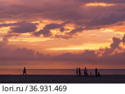 Tourists walk the Dalit Beach of Sabah (2019 год). Редакционное фото, фотограф EugeneSergeev / Фотобанк Лори