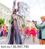 Russia, Samara, July 2019: processions of beautiful dressed up girls on Kuibyshev street at the carnival dedicated to the World Cup. Редакционное фото, фотограф Акиньшин Владимир / Фотобанк Лори