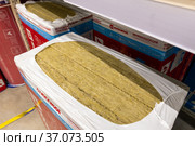Moscow, Russia - 18. Dec 2021. Rockwool Soundproof material made of polyethylene foam in Leroy Merlin store. Редакционное фото, фотограф Володина Ольга / Фотобанк Лори