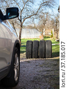 Four winter and snow used wheels are ready for change before snowfall at autumn season. Стоковое фото, фотограф Кекяляйнен Андрей / Фотобанк Лори