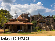 Sri Lanka. Anuradhapura. Isurumuniya Buddhist temple (Isurumuniya Rajamaha Viharaya). A popular attraction. View on a clear sunny day. Стоковое фото, фотограф Yuriy Savin / Фотобанк Лори
