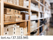 Decorative wooden jewelry storage caskets on shelves in store. Стоковое фото, фотограф Яков Филимонов / Фотобанк Лори