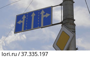 Road signs on a pole, the main road and the prohibition of truck traffic. Стоковое фото, фотограф Фотограф / Фотобанк Лори