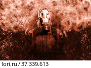 A shot of a man dressed in a gas mask, a jacket with a hood, a backpack, holding his hands in front of him as if there was something in them, looking into the camera. background grunge. Стоковое фото, фотограф Владимир Арсентьев / Фотобанк Лори