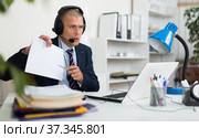 Legal counsel consulting his client via video call. Стоковое фото, фотограф Яков Филимонов / Фотобанк Лори