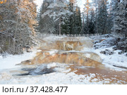 One of the most famous places in the Republic of Karelia is the Ruskeala waterfalls (the filming location of the Soviet film "The Dawns Here Are Quiet...") in the winter season. Traveling in Russia, Republic of Karelia. Стоковое фото, фотограф Алексей Кокоулин / Фотобанк Лори