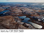 Aerial view and top view of the Lake in the tundra on the Taimyr Peninsula in Russia. Beautiful natural background. Blurred image, selective focus. Стоковое фото, фотограф Александр Сергеевич / Фотобанк Лори