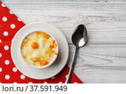 Mushroom juliene in bowl on wooden background. Стоковое фото, фотограф Сергей Толмачёв / Фотобанк Лори