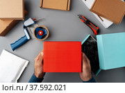 Above table top view of warehouse preparing post courier delivery package. Стоковое фото, фотограф Сергей Толмачёв / Фотобанк Лори