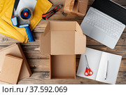 Packing products for delivery on wooden table, top view. Стоковое фото, фотограф Сергей Толмачёв / Фотобанк Лори