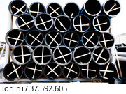 Plastic pipes production plant warehouse. Black PVC tubes. Стоковое фото, фотограф Alexey Rezvykh / Фотобанк Лори