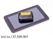 Old pager and new tablet computer on white background. Стоковое фото, фотограф Евгений Ткачёв / Фотобанк Лори