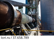 Jambyl Cement plant gas furnace (rotary clinker kiln) for cement production. Mynaral, Kazakhstan. Стоковое фото, фотограф Alexey Rezvykh / Фотобанк Лори