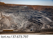 Copper ore open-pit mining (quarry) in steppe. White gravel road. Blue sky background. Стоковое фото, фотограф Alexey Rezvykh / Фотобанк Лори
