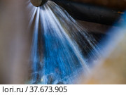 Blurred photo background. Washing gold ore on concentrating plant. Motion blurred water jets. Khromtau, Mechel, Kazakhstan. Стоковое фото, фотограф Alexey Rezvykh / Фотобанк Лори