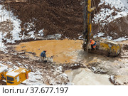 Workers are drilling the ground to inject the solution. Стоковое фото, фотограф Юрий Шурчков / Фотобанк Лори