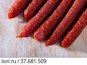Tyrolean sausages and peppercorns on wooden table. Стоковое фото, фотограф Яков Филимонов / Фотобанк Лори