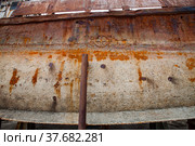 Mangystau, Kazakhstan - May 19, 2012: Old rusted steel ship's bottom on Caspian Sea ship-repairing yard. Bautino bay. closeup photo. Стоковое фото, фотограф Alexey Rezvykh / Фотобанк Лори