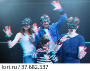 Family with children playfully poses in virtual reality glasses. Стоковое фото, фотограф Яков Филимонов / Фотобанк Лори