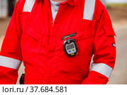 Uralsk region, Kazakhstan - May 24 2012: Oil deposit Zhaikmunai. Refinery plant. Safety technologies. Compact handheld gas leak detector (gas analyzer) Drager. Personal for every worker. Редакционное фото, фотограф Alexey Rezvykh / Фотобанк Лори