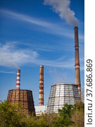 Pavlodar thermal electric station. Smoke stacks with white smoke. Cooling towers on foreground. Стоковое фото, фотограф Alexey Rezvykh / Фотобанк Лори
