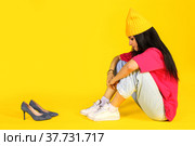 Girl looking at a heel shoes with sadness. Стоковое фото, фотограф Art Konovalov / Фотобанк Лори