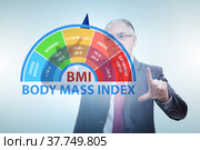 Concept of BMI - body mass index with nutritionist. Стоковое фото, фотограф Elnur / Фотобанк Лори