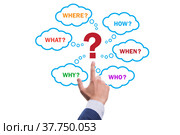 Concept of many different questions asked with businessman. Стоковое фото, фотограф Elnur / Фотобанк Лори