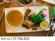 Young bull meat in its own juice with herbs. Khashlama. Стоковое фото, фотограф Яков Филимонов / Фотобанк Лори