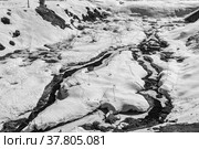 Streams running through snowdrifts. Black and white contrast photo. Стоковое фото, фотограф Yuriy Savin / Фотобанк Лори
