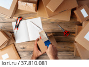 Packing products for delivery on wooden table, top view. Стоковое фото, фотограф Сергей Толмачёв / Фотобанк Лори