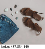 Summer fashion, vacation on sea concept. flat lay composition with sandals and denim shorts top view. Стоковое фото, фотограф Galina kondratenko / Фотобанк Лори