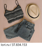 Summer fashion, vacation on sea. Swimwear, denim jeans, straw hat top view, flatlay. Стоковое фото, фотограф Galina kondratenko / Фотобанк Лори