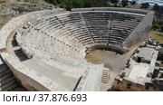 Picturesque landscape overlooking the Roman amphitheater in the ancient Lycian city of Rhodiapolis, currently located in Antalya province, Turkey. Стоковое видео, видеограф Яков Филимонов / Фотобанк Лори