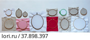 Panoramic view of hoops prepared for embroidery of different sizes and types. Cotton and linen special square-mesh fabric stretched over the frames. Banner, flat lay, copy space, top view. Стоковое фото, фотограф Виктория Катьянова / Фотобанк Лори