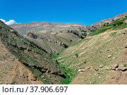 Mountain landscape with rocky cliffs, in the distance the mountain village of Chokh in Dagestan. Стоковое фото, фотограф Евгений Харитонов / Фотобанк Лори