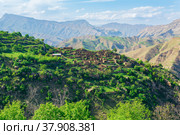 Ruins of houses on a mountainside in Kurib, a depopulated village with the only remaining household with an apiary, Dagestan. Стоковое фото, фотограф Евгений Харитонов / Фотобанк Лори