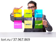 Concept of many different questions asked with businessman. Стоковое фото, фотограф Elnur / Фотобанк Лори