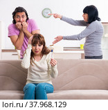 Young family and mother-in-law in family issues concept. Стоковое фото, фотограф Elnur / Фотобанк Лори