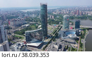 Aerial view of central part of modern city with skyscrapers and residential buildings. River and bridge on summer day. Yekaterinburg. Russia (2020 год). Редакционное видео, видеограф Евгений Ткачёв / Фотобанк Лори