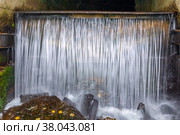 Waterfall from the hydrotechnical tunnel of the Kamenka River. The village of Paramonovka. Chelyabinsk region (2021 год). Стоковое фото, фотограф Акиньшин Владимир / Фотобанк Лори