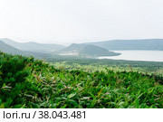 Natural landscape of Kunashir island, view of the Golovnin volcano caldera with hot lakes. Стоковое фото, фотограф Евгений Харитонов / Фотобанк Лори