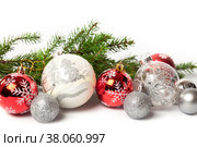 White and red Christmas decorations baubles and spruce branch on white background. Стоковое фото, фотограф Юлия Бабкина / Фотобанк Лори