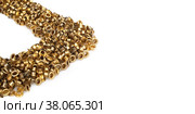 Spilled gold grommets isolated on white background. Стоковое фото, фотограф Елена  Попкова / Фотобанк Лори