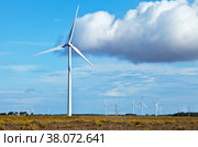 Wind generator on a wind farm in Europe against a blue sky with clouds on a sunny summer day. Alternative energy sources (2012 год). Стоковое фото, фотограф Виктория Катьянова / Фотобанк Лори
