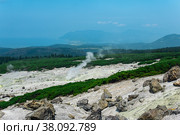 Fumarole field on the slope of Mendeleev volcano on Kunashir island overlooking the ocean in the haze. Стоковое фото, фотограф Евгений Харитонов / Фотобанк Лори